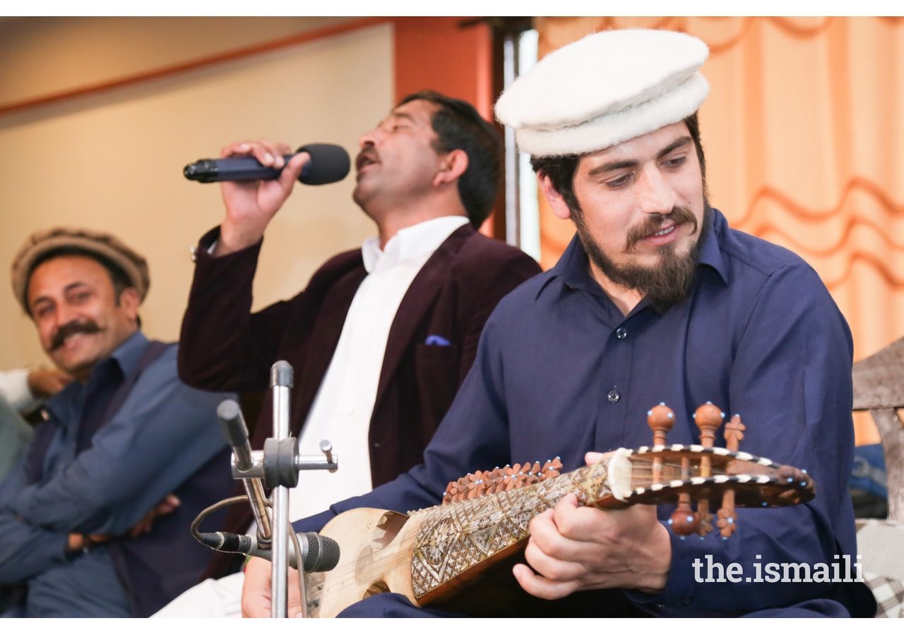 Hunza residents sing regional songs and play Charda, a regional guitar like five-string instrument at a community gathering performance.