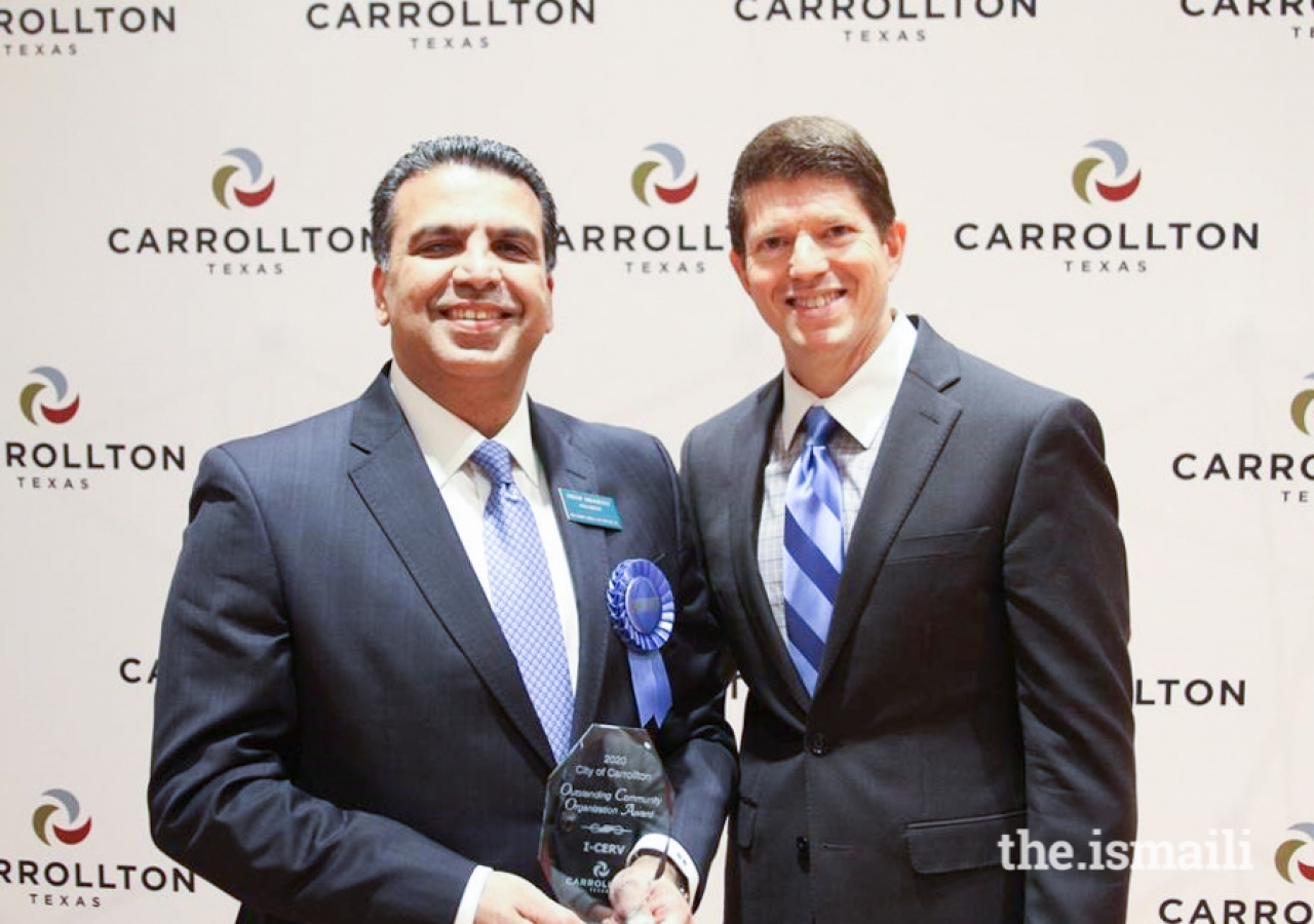 Mayor Kevin Falconer presenting the Outstanding Community Organization Award to President Nizar Didarali of the Ismaili Council for the Central United States.