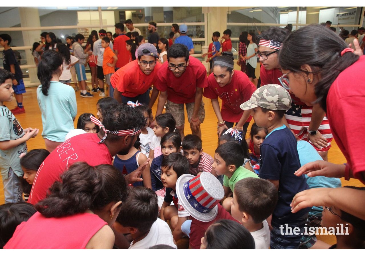 Group of counselors in Atlanta with participants during arrival playing Magic Box Activities.