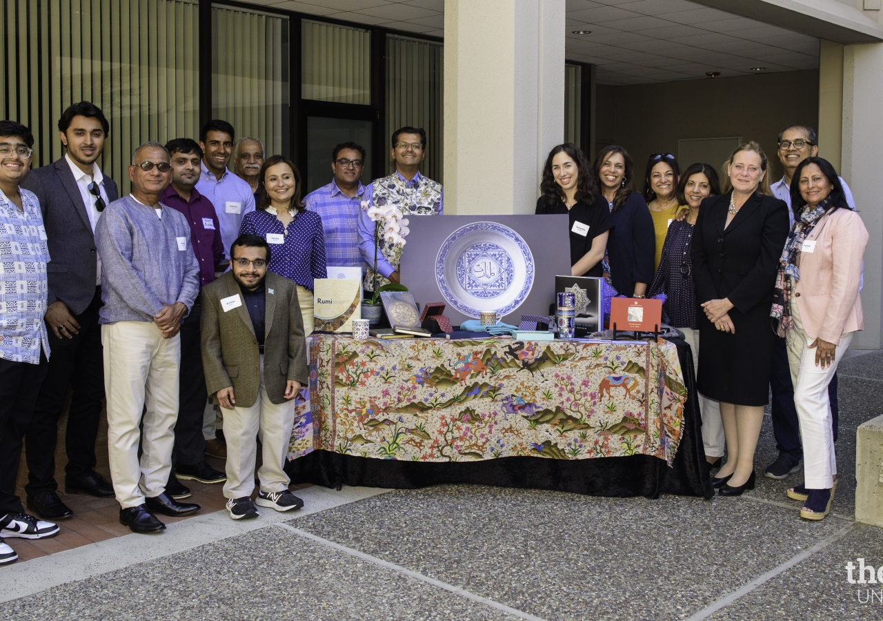 Organizers and representatives of the Aga Khan Museum's Development Team showcase museum items.