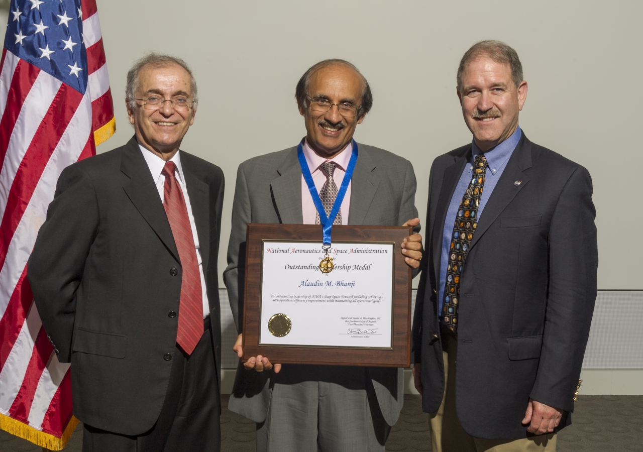 Alaudin Bhanji receiving NASA's Outstanding Leadership Award, in 2014. He is with the (then) Director of the Jet Propulsion Laboratory, Dr. Charles Elachi (L), and Dr. John M. Grunsfeld, Associate Administrator, Science Mission Directorate, NASA.