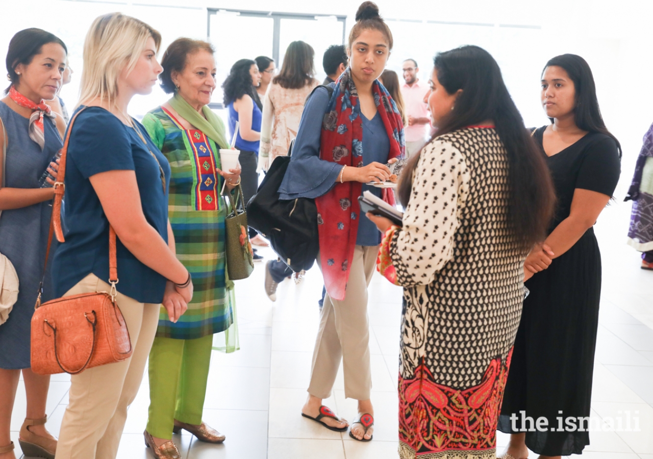 Book launch event attendees are greeted by Dr. Nadya Merchant as they arrive.