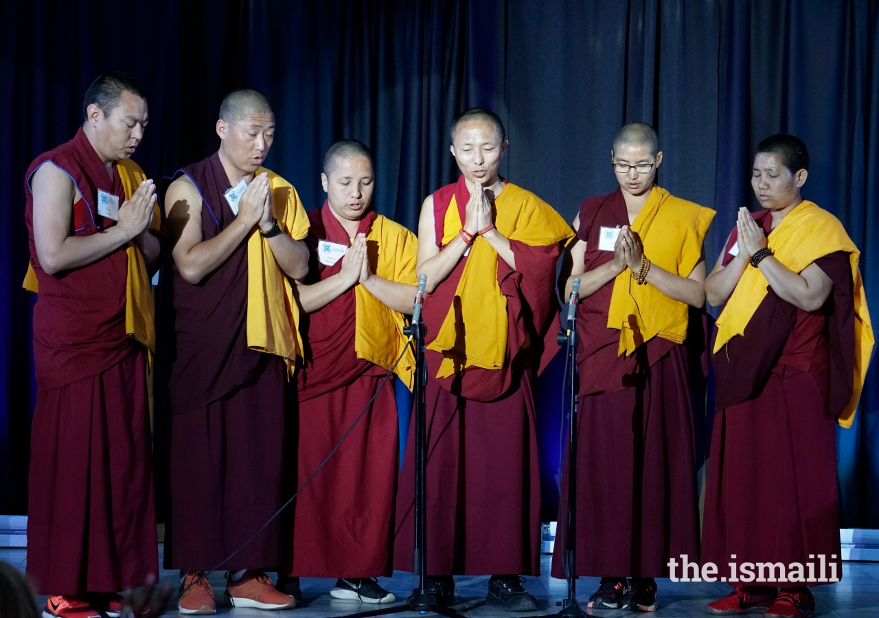 Buddhist monks and Nuns from Emory University’s Tenzin Gyatso Science Scholar Program perform a prayer chant about developing friendship and unity among practitioners of different disciplines.