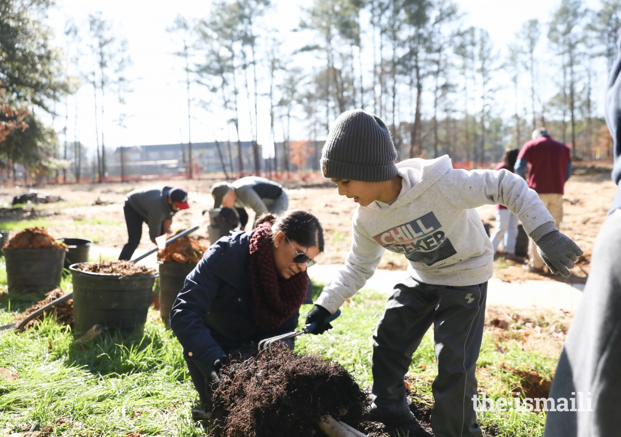 Mother and son prepare mulch at Brook Run Park in Dunwoody, Georgia.