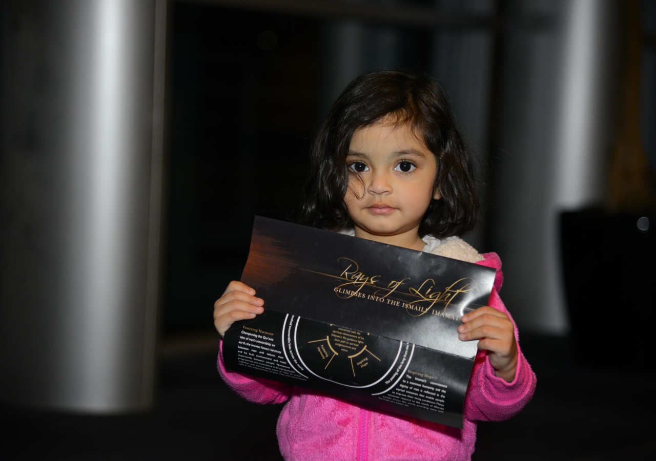 A young Jamati member at the Rays of Light exhibition.