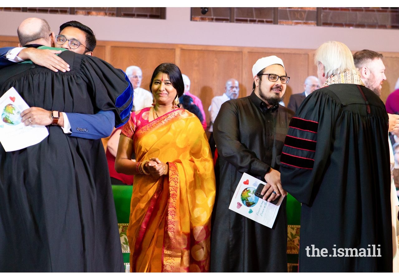 Representatives of the interfaith communities greeting one another at the conclusion of the service.