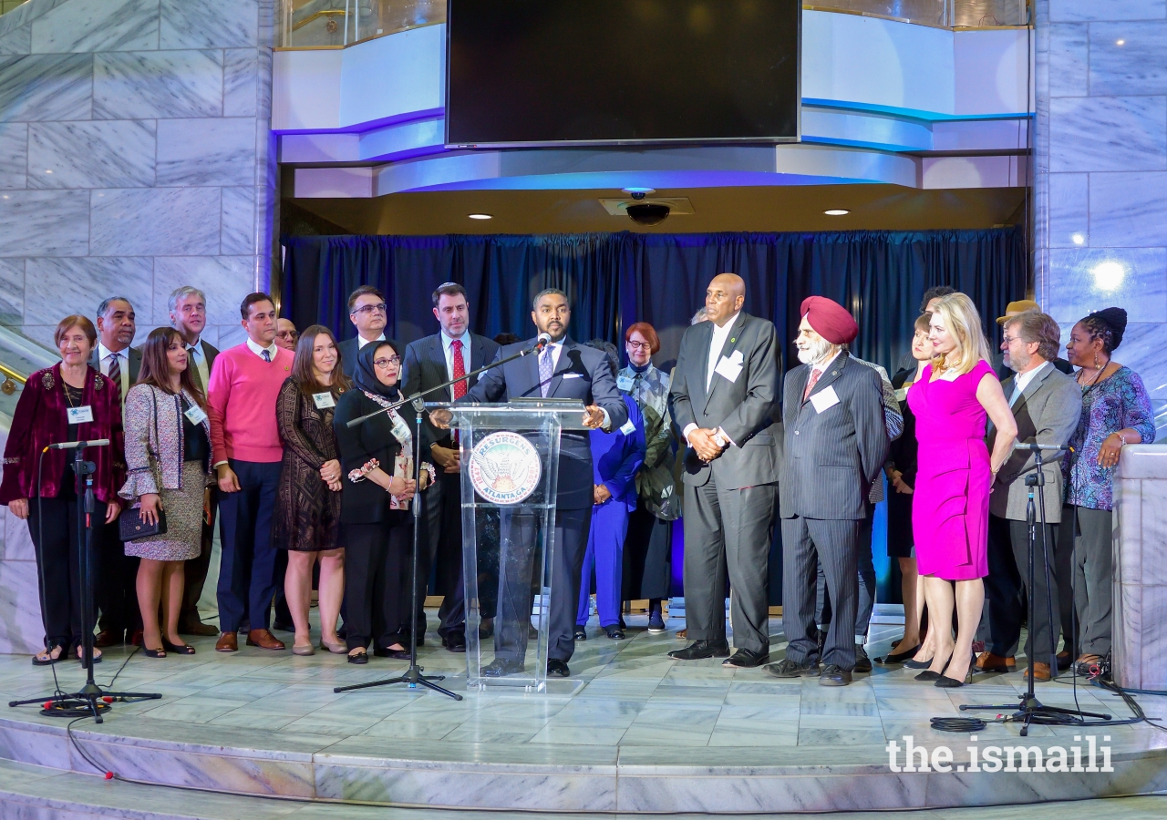 Dr. Robert Hughes, Councilmember Michael Julian Bond's executive staff, presented the Proclamation to the diverse faith and civic leaders of the host committee, declaring April 4, 2019, as Atlanta’s inaugural Day of Religious Pluralism.