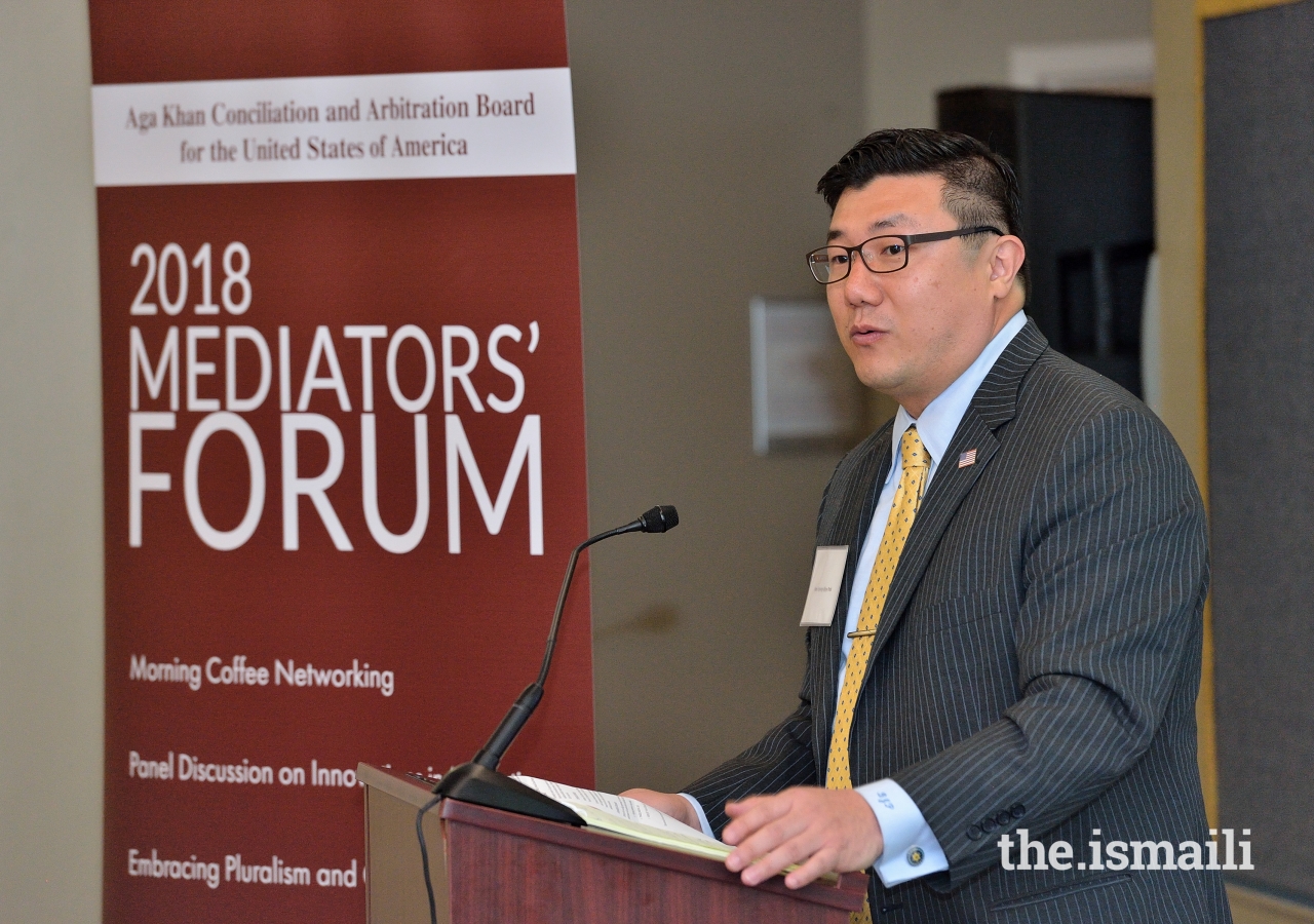 United States Attorney, BJay Pak delivers opening remarks at the 2018 Mediators Forum held at the Ismaili Jamatkhana in Decatur, Georgia.