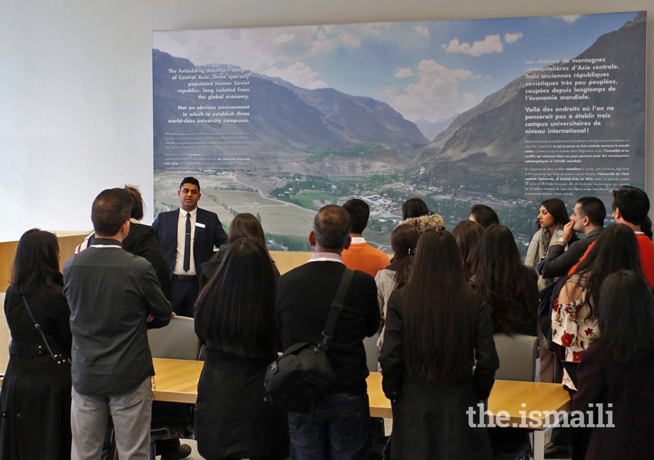 A guide leads a group of Jubilee Heritage participants on a tour of the Delegation of the Ismaili Imamat.