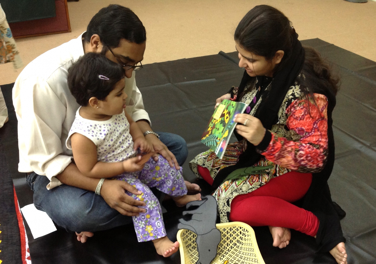 Parents play with their child during a Parwaaz early child development session. Ismaili Council for Pakistan