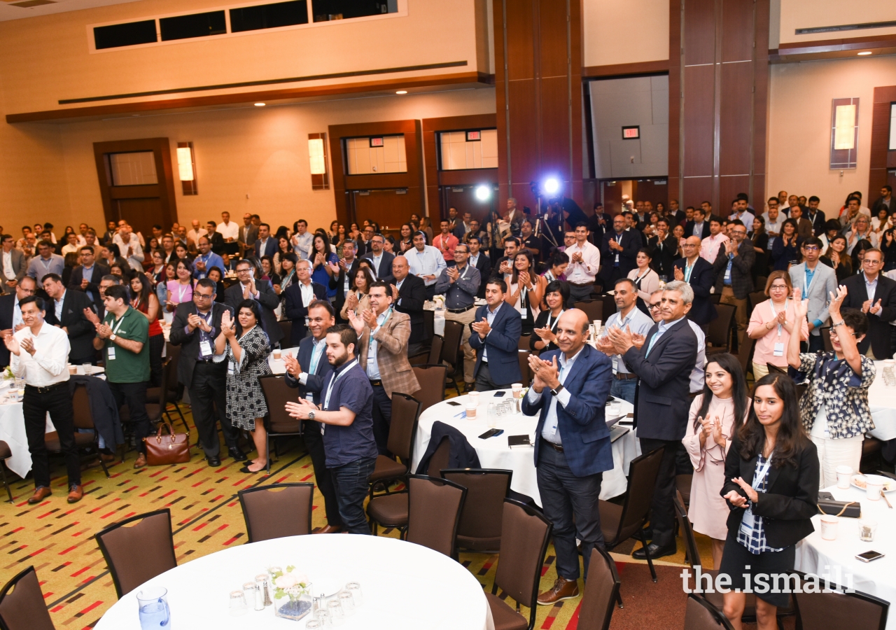 The participants rise in applause to show their appreciation for the volunteers and organizers as the DJAC weekend comes to a close.