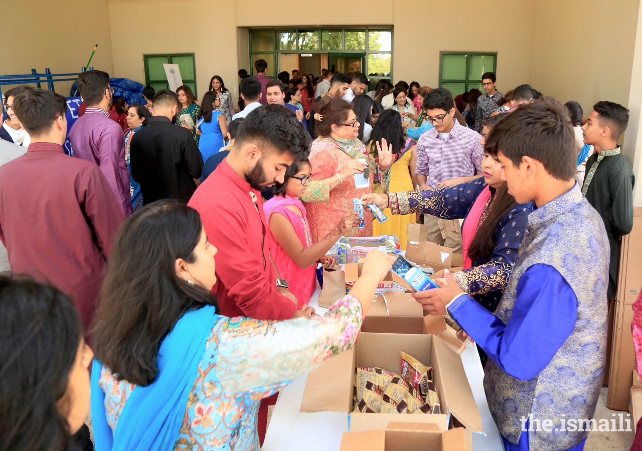 The Jamat in the Dallas area preparing 6,000 snacks for local charities.