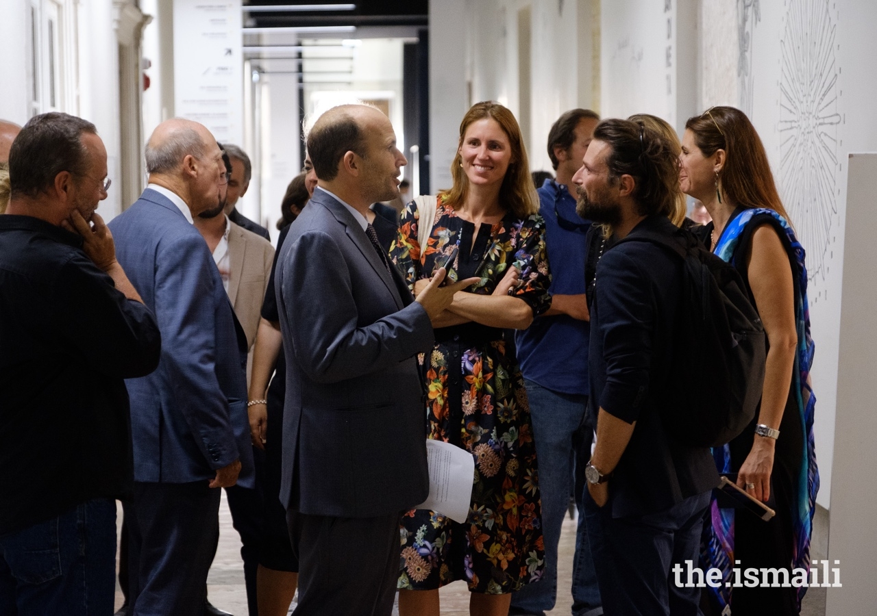 Prince Hussain in conversation with guests gathered at the inauguration of his The Living Sea photo exhibition in Lisbon.