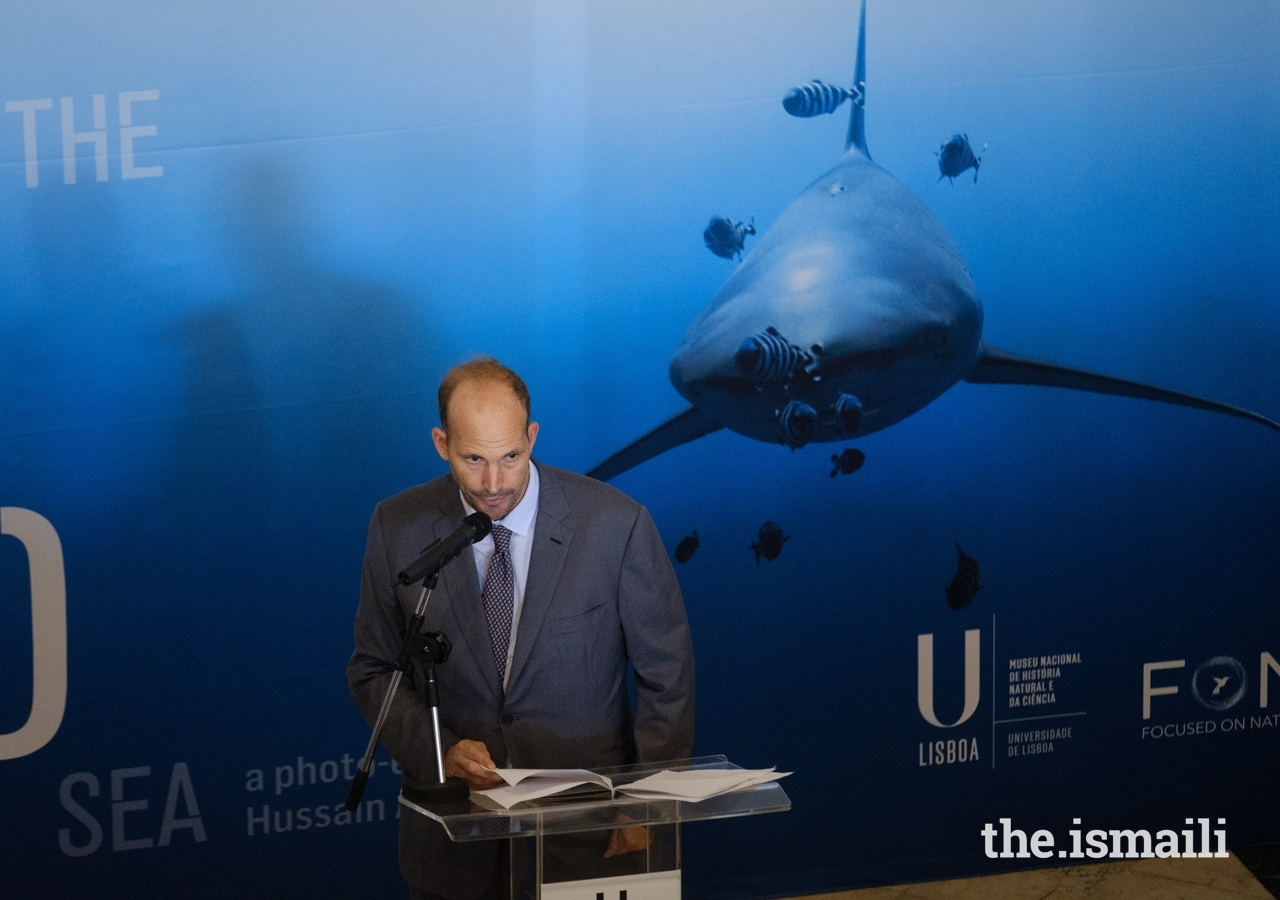 Prince Hussain addresses guests at the inauguration of his The Living Sea photo exhibition in Lisbon.