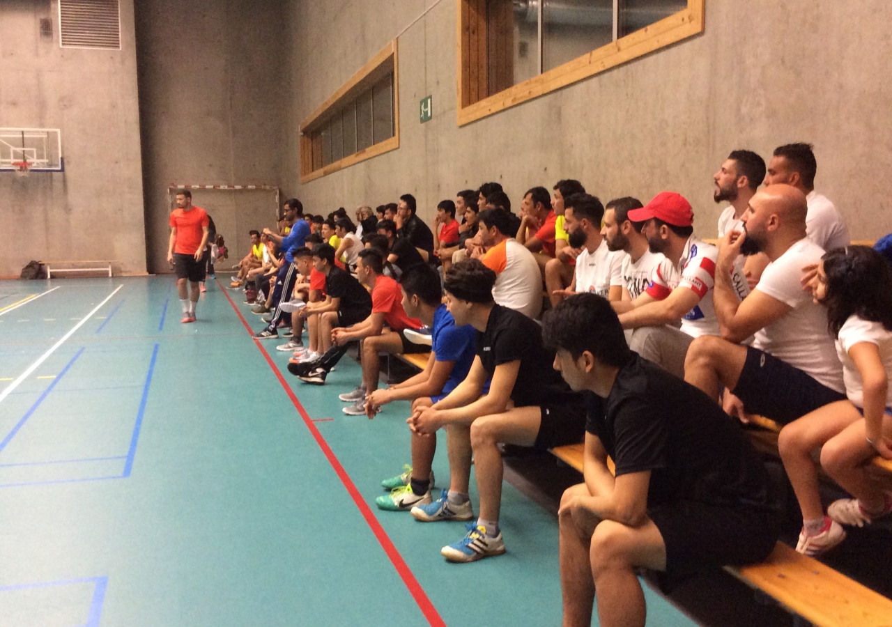 Spectators gather to watch a volleyball game in Gent