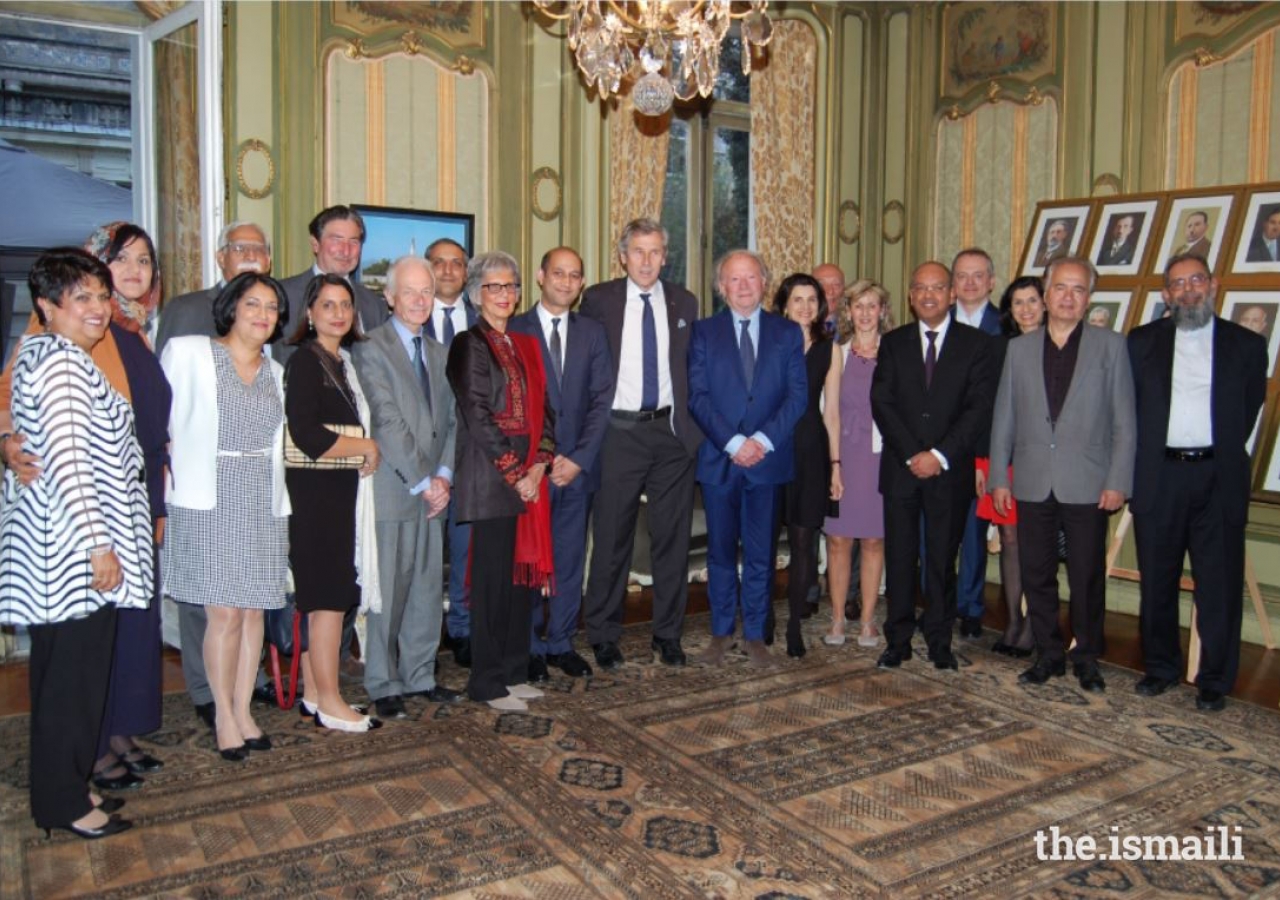 His Excellency Abdel-Ellah Sediqi, Afghan Ambassador to France, AKDN representatives, guests, and leaders and members of the Ismaili community gather for a group photo.