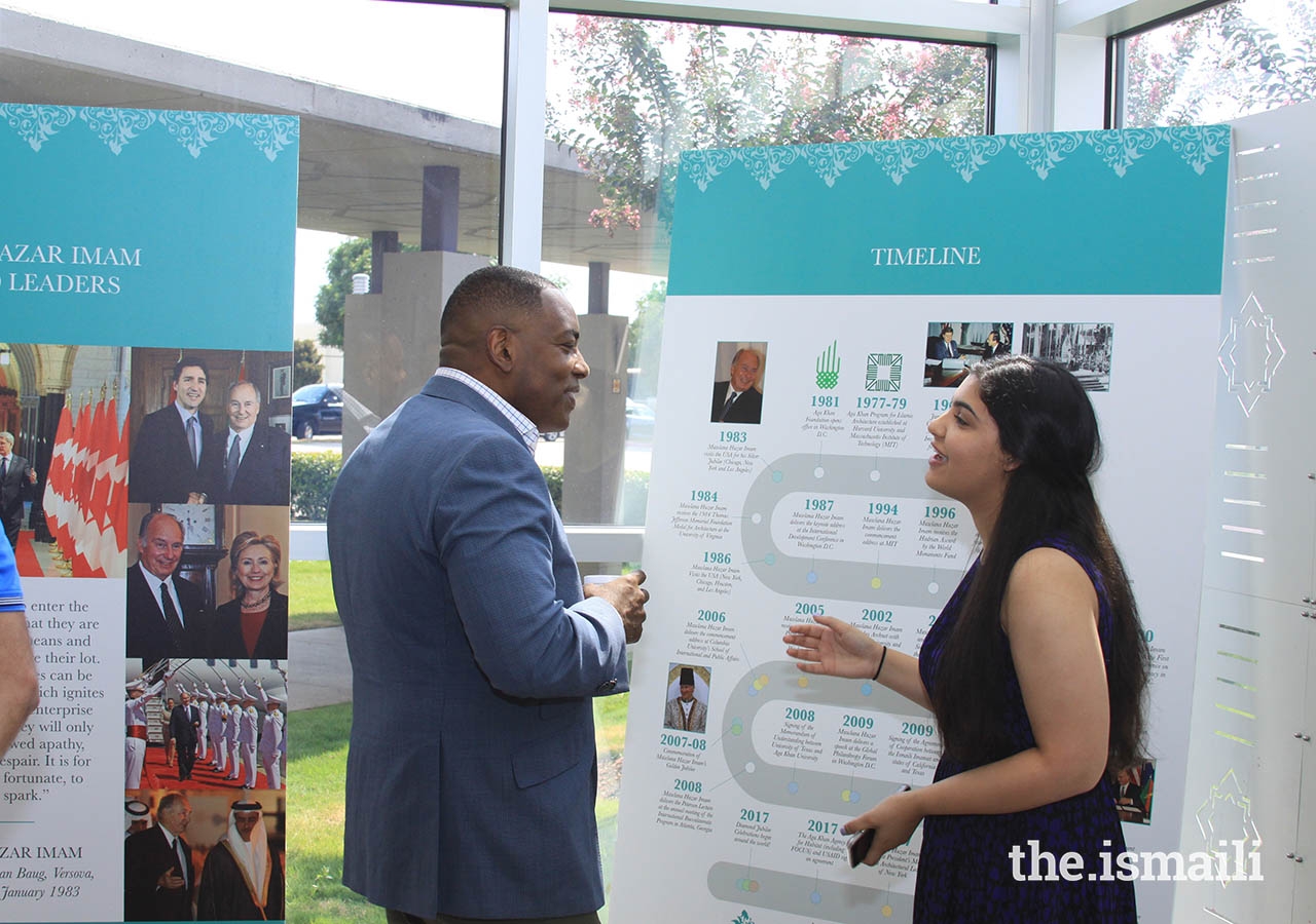 Student guide Jasmine Babool with Mayor Harry LaRosiliere at the Plano Jamatkhana open house.