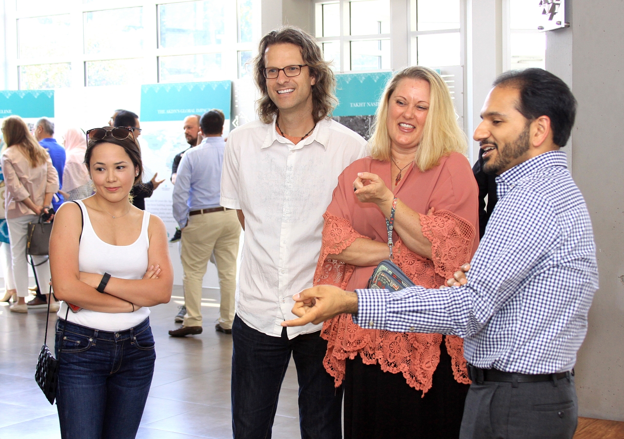 Jennifer Hernandez and friends engage in an animated discussion inside Plano Jamatkhana. Although anxious before coming, visitors like Hernandez left with an appreciation for the building and the people inside it.