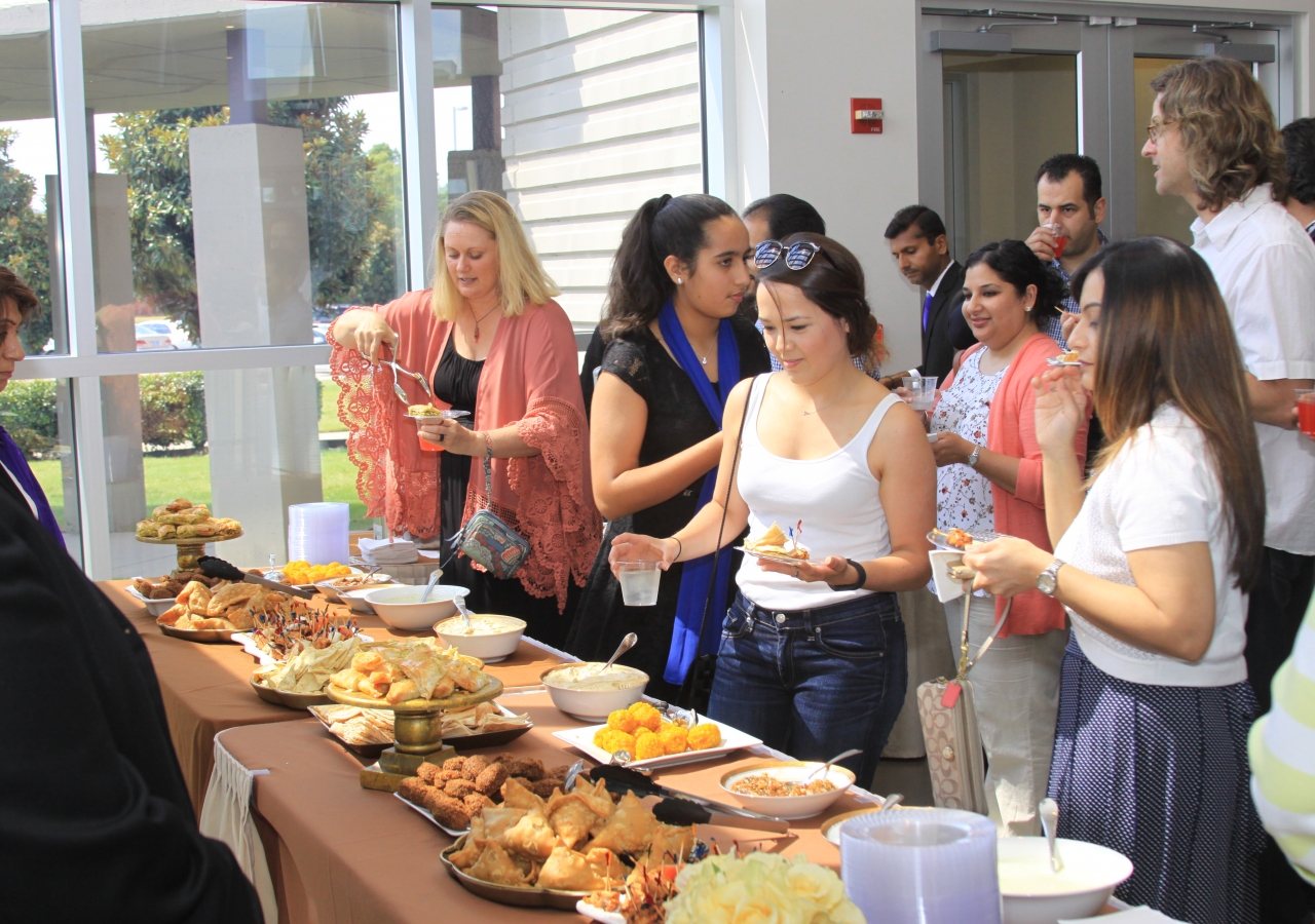 Visitors enjoying flavors from the diverse cultures of the Ismaili Muslim Community.