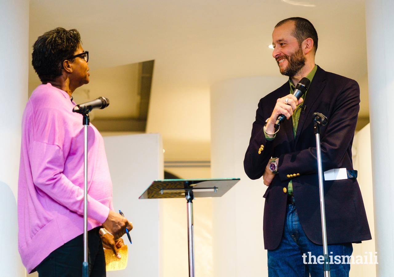 Artist Guillaume Bonn participates in an on-stage conversation with Dr Dayo Forster (left), at the inauguration of the Dreams and Dystopias exhibition at the Ismaili Centre, London.