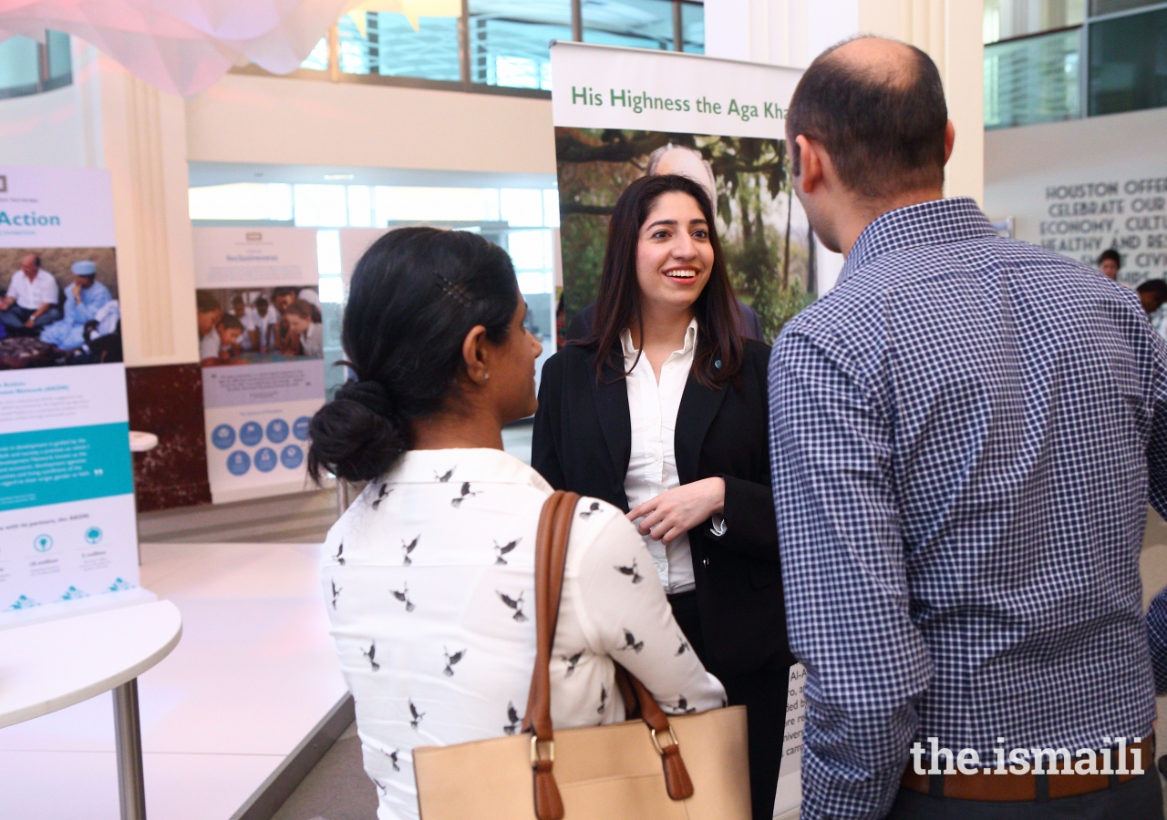 Ethics in Action tour guide welcomes guests to the exhibition.