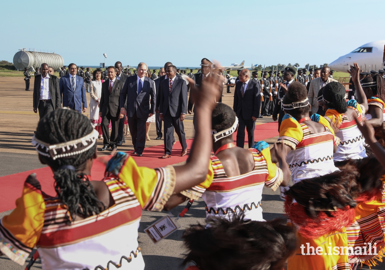 Mawlana Hazar Imam is greeted by local dancers performing a traditional welcome.