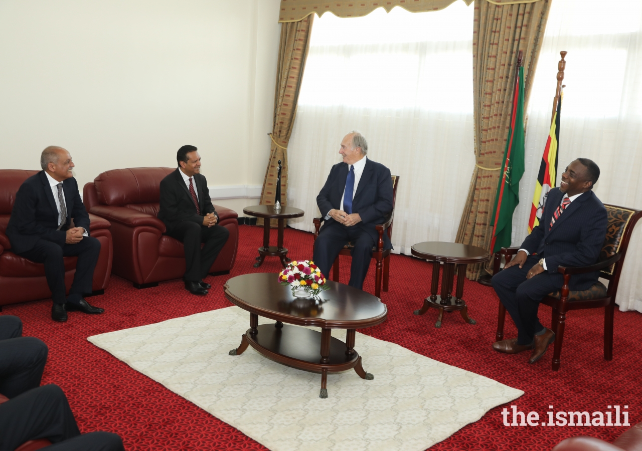 Ismaili Council for Uganda President Minaz Jamal, AKDN Resident Representative Amin Mawji, Mawlana Hazar Imam and Attorney General Hon. William Byaruhanga share a light moment at Entebbe airport.