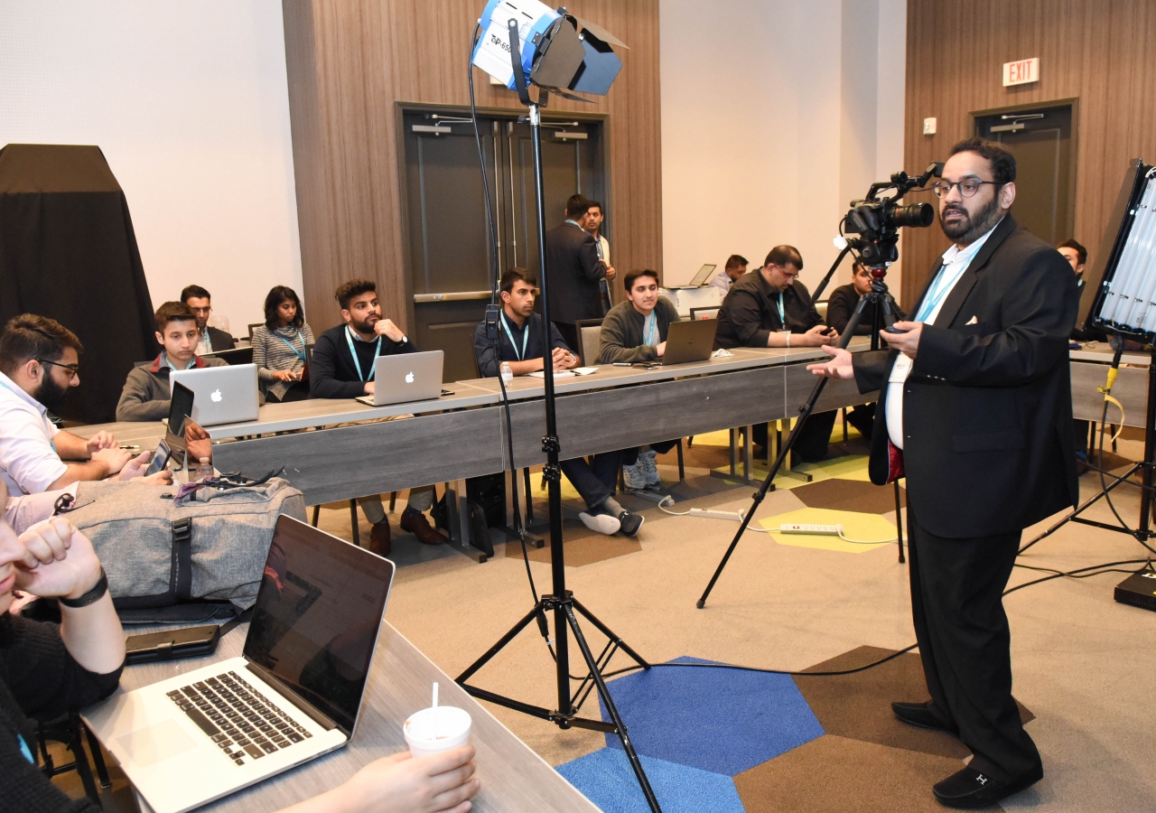 Volunteers participate in a photography training workshop.