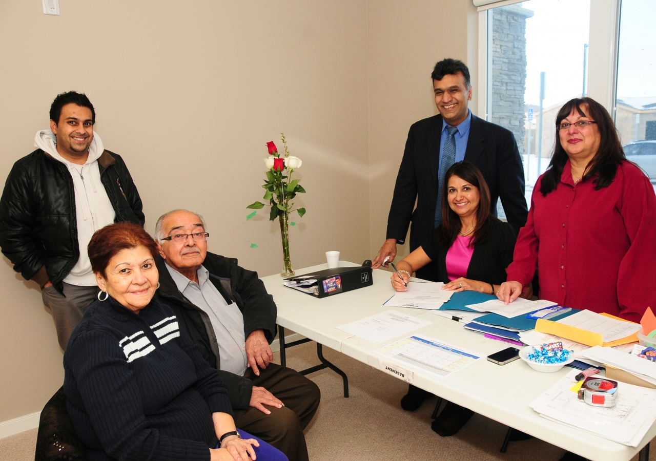 Residents transitioning, with the help of volunteers,  to their new home in Generations Phase I 