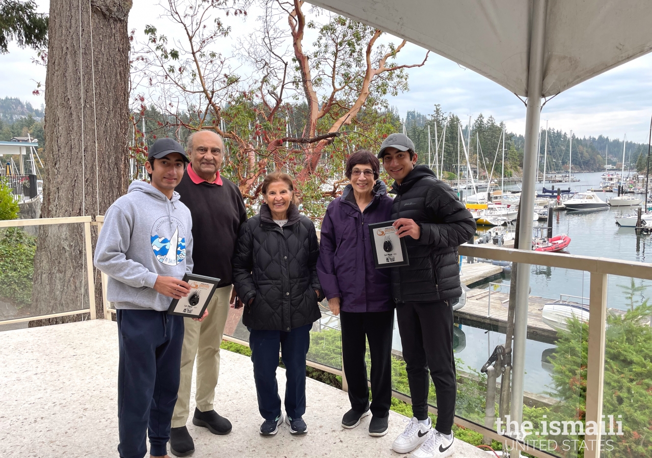 Nikhil and Emil placed first in their hometown race at the West Vancouver Yacht Club, in 2022. Here, they are seen receiving their award with their grandparents Amin & Leila Lalani, and Gulshan Damji.