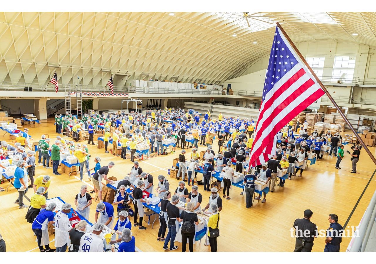 Ismaili volunteers help pack meals at the 9/11 Day of Service alongside the Los Angeles community.