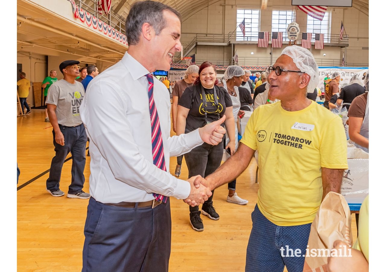 Los Angeles Mayor Eric Garcetti gives Karim Gowani a thumbs up at the 9/11 Day of Service.