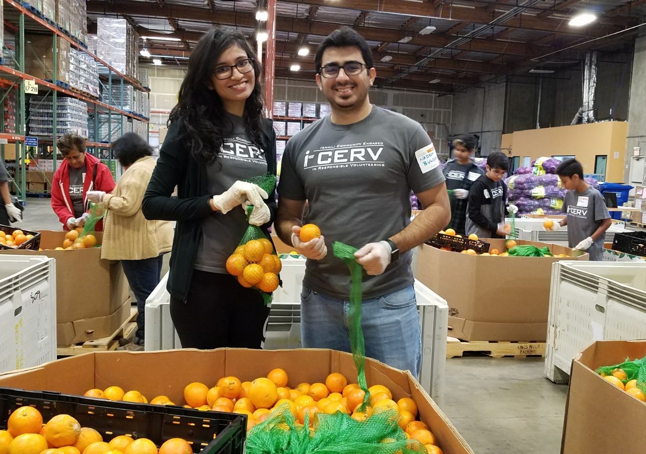 Volunteers assist with packing food for fire victims