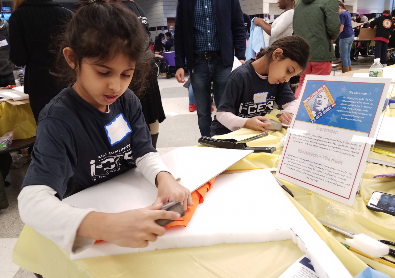 Young I-CERV Boston volunteers  commemorate MLK day through supporting  local immigrant and refugee families through the creation of ESOL (English for Speakers of Other Languages) learning tools 