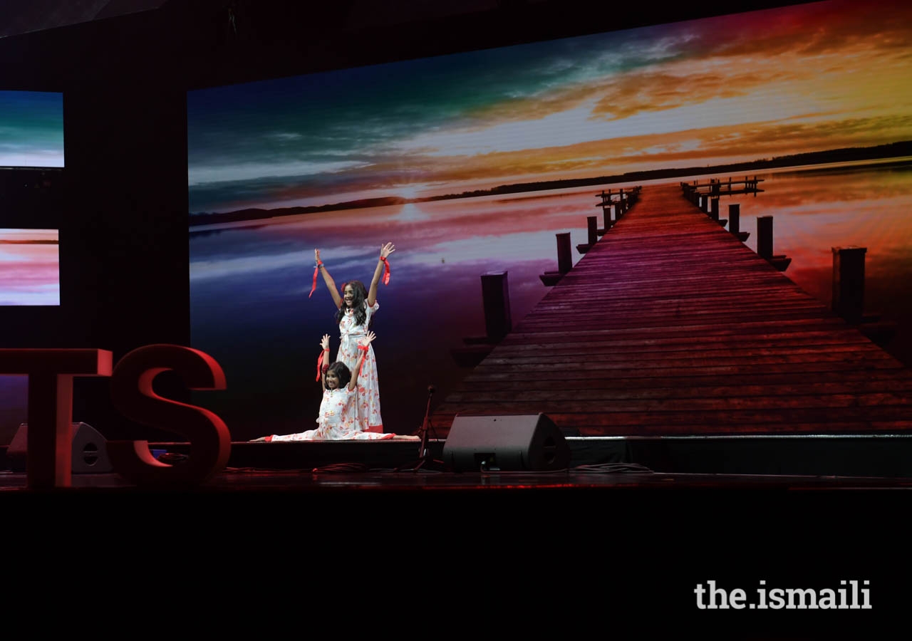 Young performers from Madagascar are applauded by the audience.