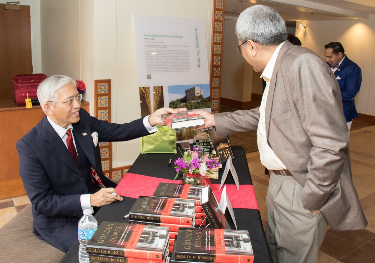 Ambassador Siv signs copies of his books at The Ismaili Jamatkhana and Center, Houston.