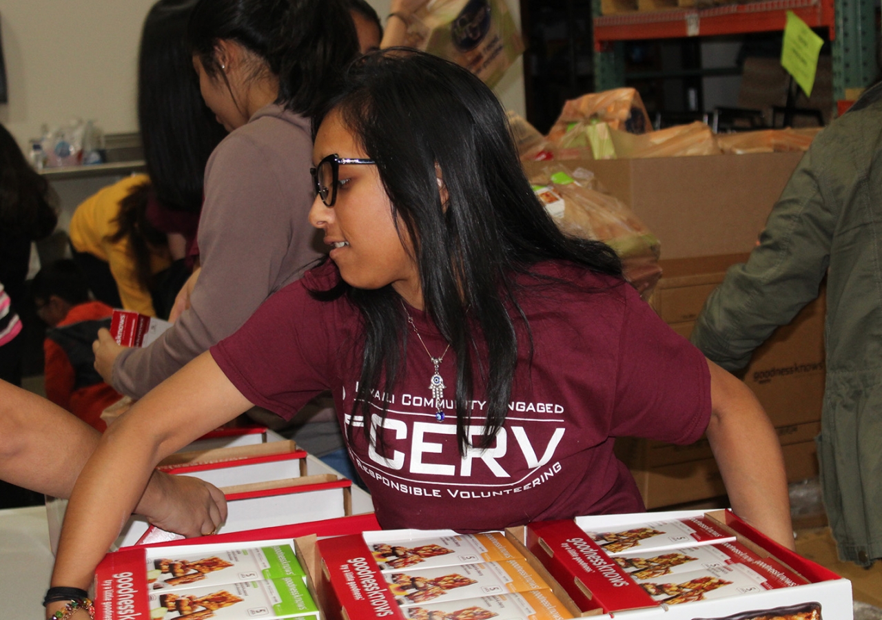 Niha Mitha helps sort food at the Midwest Food Bank in Atlanta, along with other members of the southeastern I-CERV team. Saba Verani