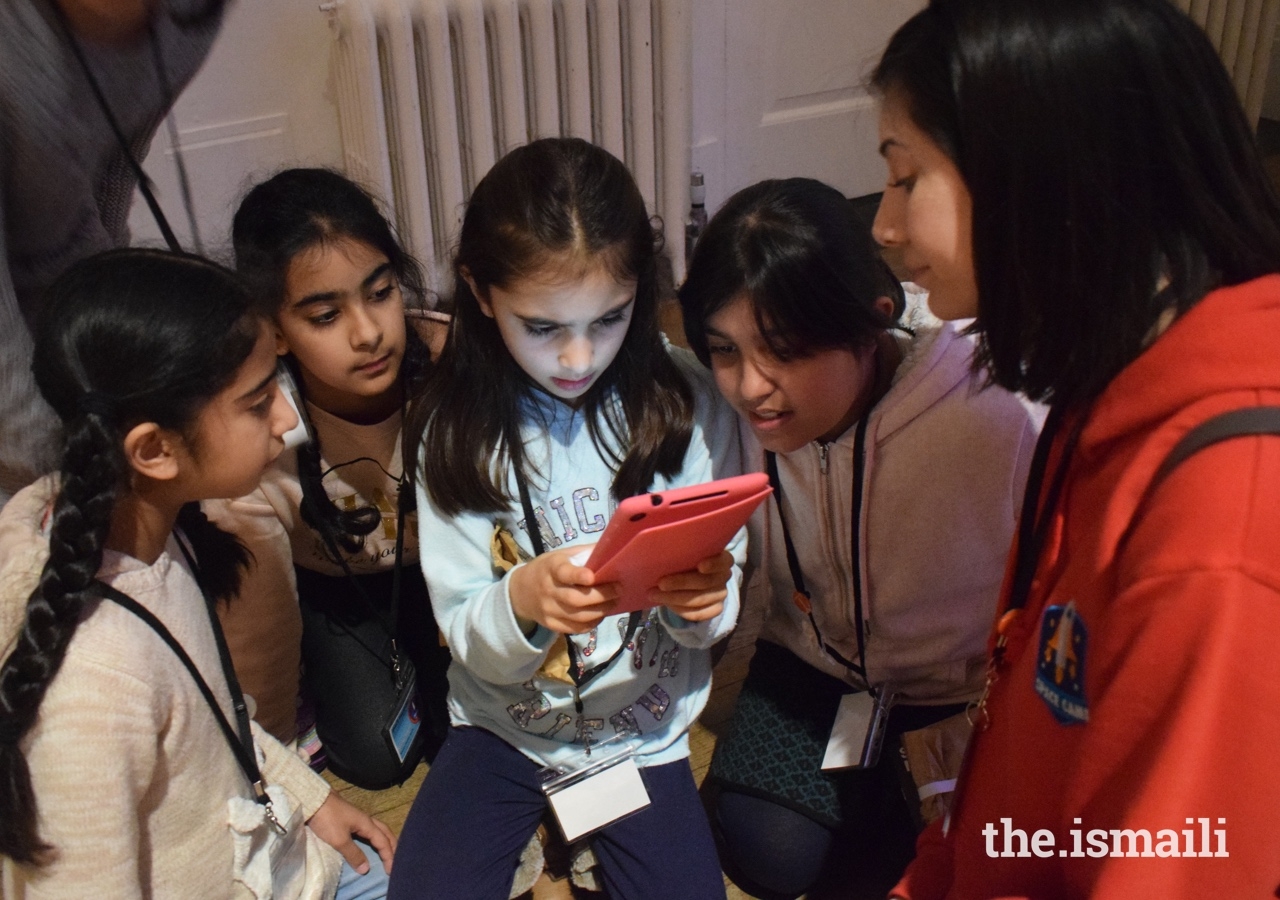 Participants use tablet computers to complete a space challenge.