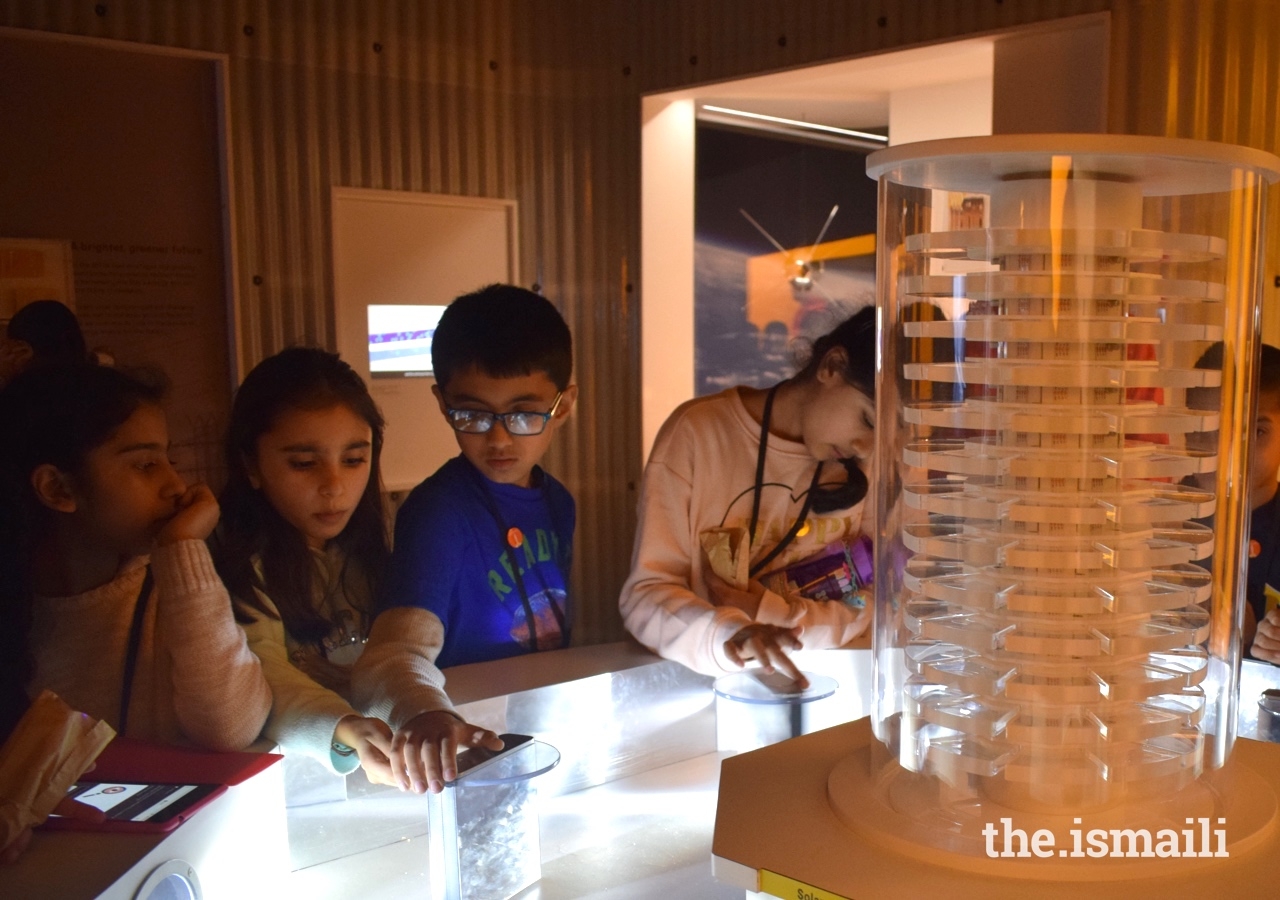 At the Science Museum in London, students use light reflectors to generate enough solar energy to power a light tower.