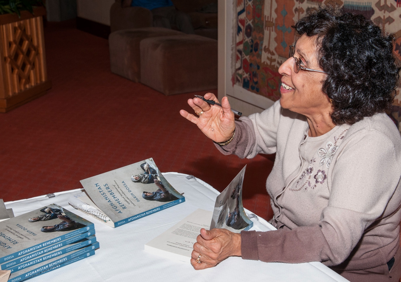 Parin Dossa signing her books at the Ismaili Centre in Vancouver. Sultan Baloo