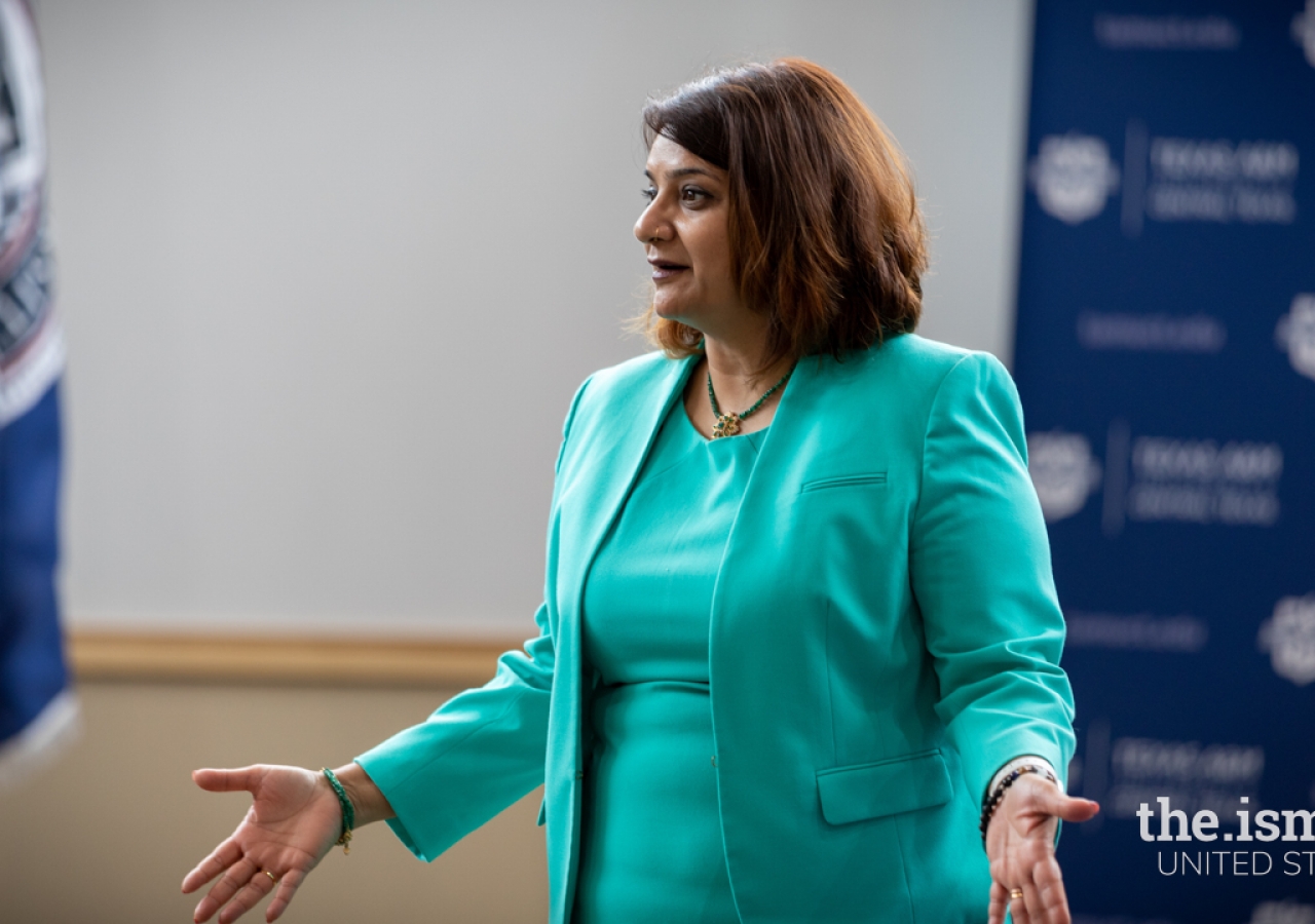 Dr. Faiza Khoja talking to healthcare executives visiting the Texas A&M University campus to partner on revising the existing healthcare administration curriculum.