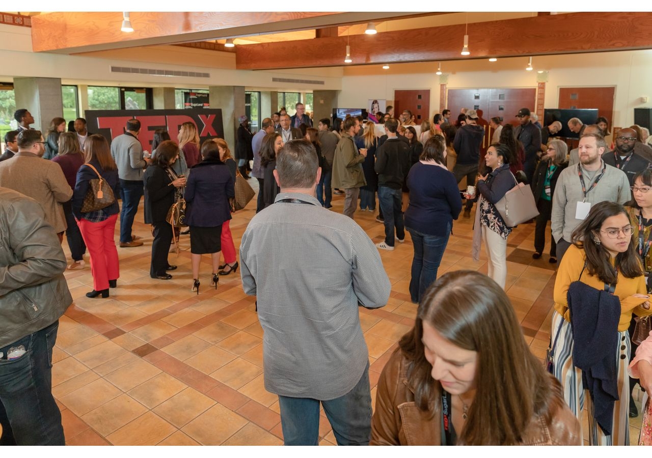 Attendees networking at the TEDxSugarLand being held at Ismaili Jamatkhana and Center.