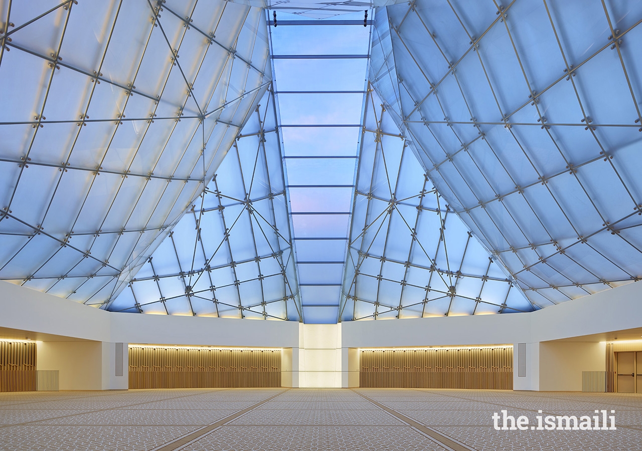 Inside the Jamatkhana at the Ismaili Centre, Toronto, the central skylight panel descends to a white translucent onyx block.