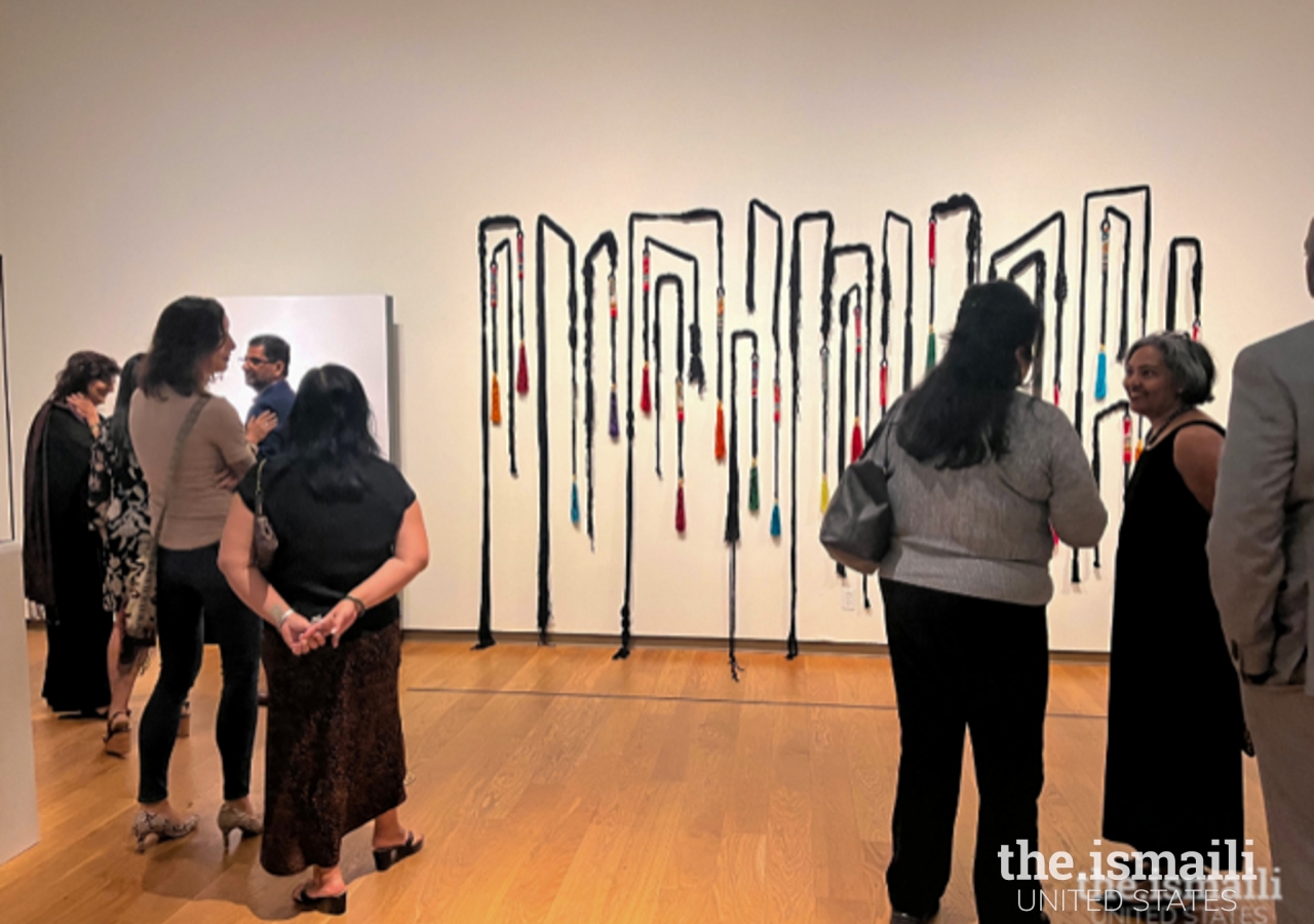 Guests interacting with the exhibit during the VIP Opening Reception at the Orlando Museum of Art.