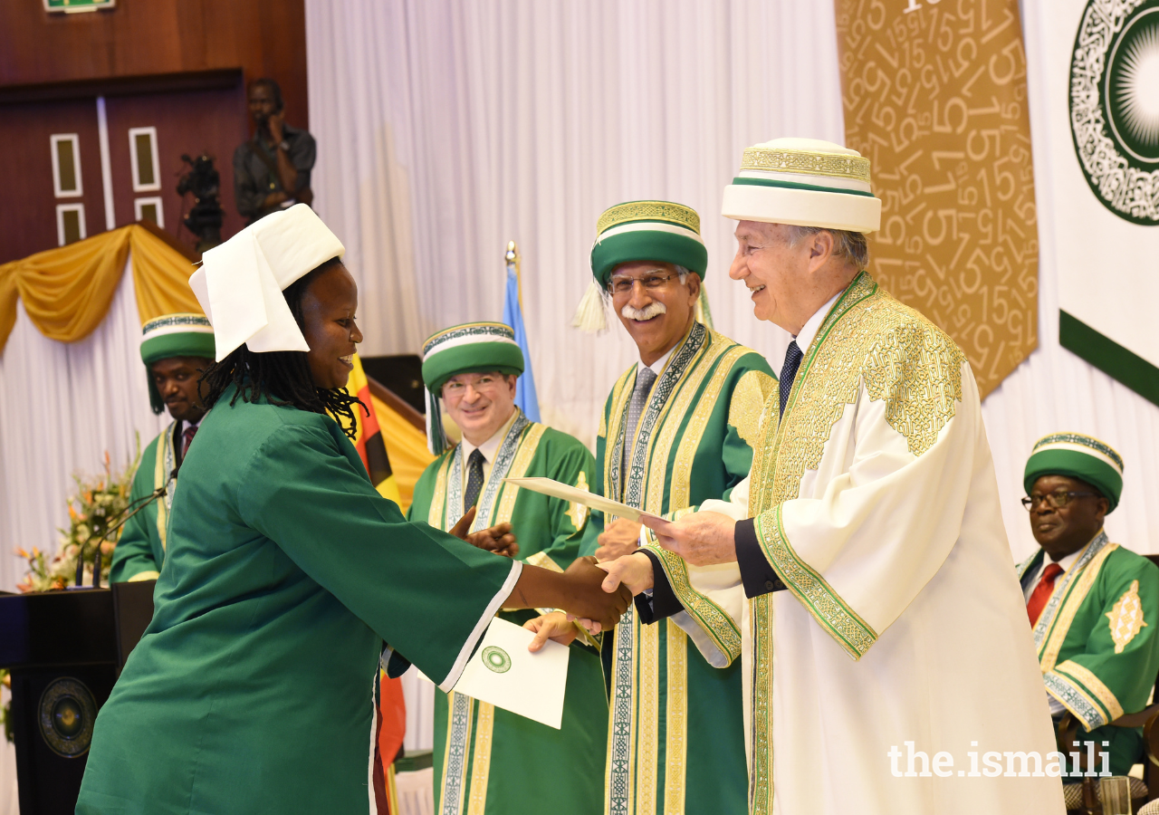 Hazar Imam grants a degree during the Convocation ceremony in 2013 as President Firoz Rasul looks on.