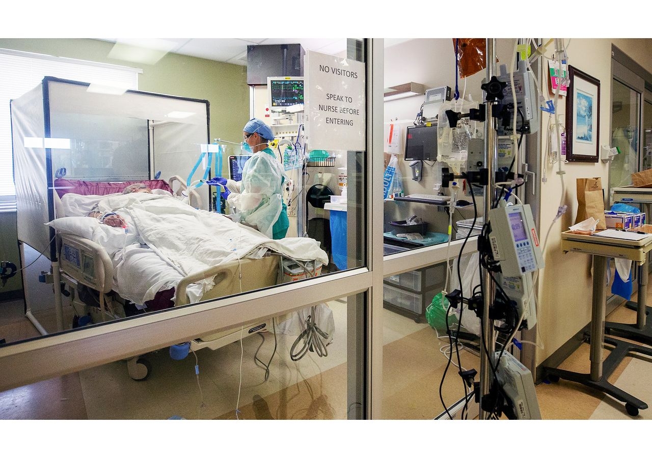 Registered nurse Aubry Sander cares for a COVID-19 patient in a negative pressure room (NPR) at Gulf Coast Medical Center in Fort Myers, Florida. NPR’s help prevents cross-contamination from room to room.