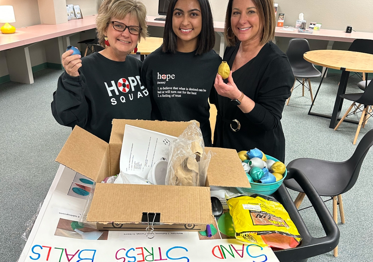 Zania delivering stress-relieving fidget objects to Hope Squad directors and Carroll High School counselors.