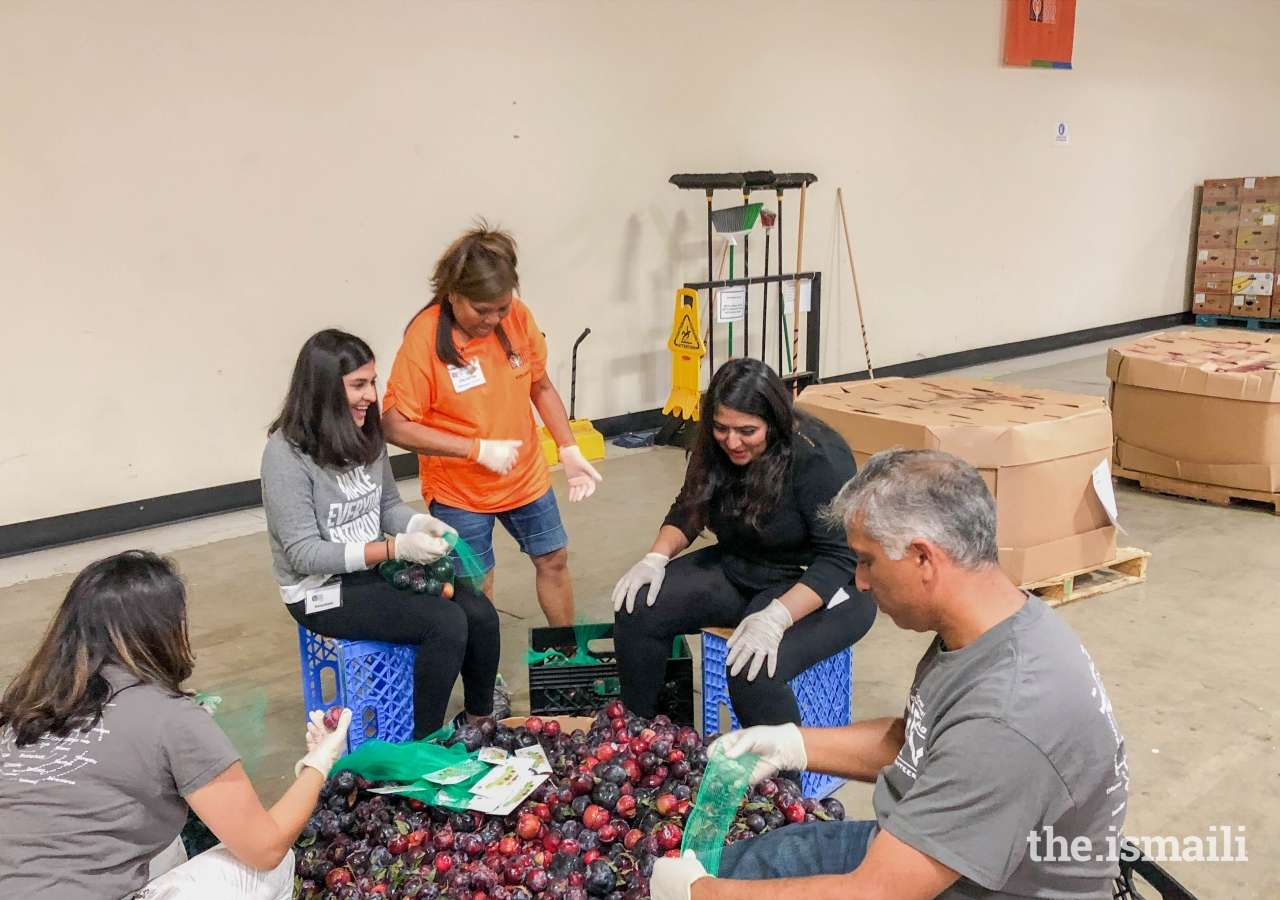 Orange County volunteers helping at the Second Harvest Food Bank.