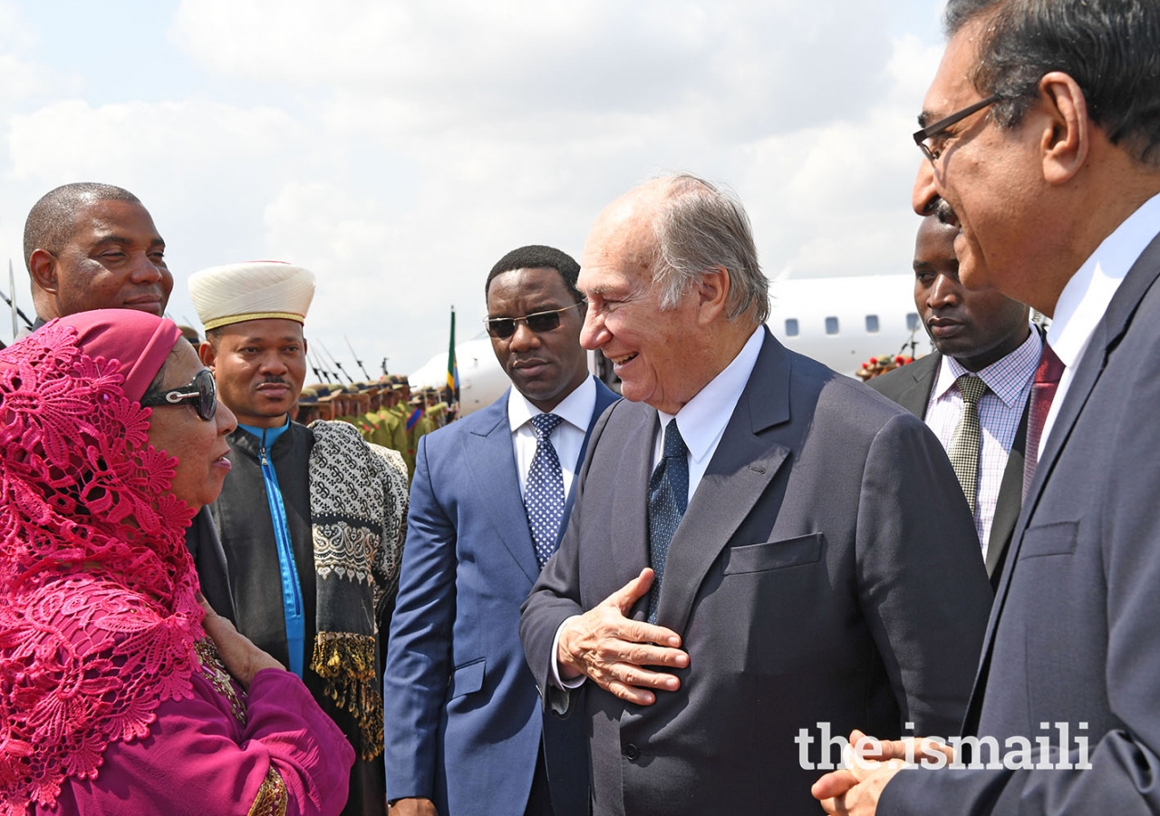 Mawlana Hazar Imam is greeted by a Member of Tanzania's Peace Committee, Ms. Shamim Parker.