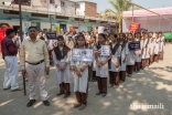 Local school children and Aga Khan Health Board volunteers armed with placards and slogans for Oral Cancer awareness.